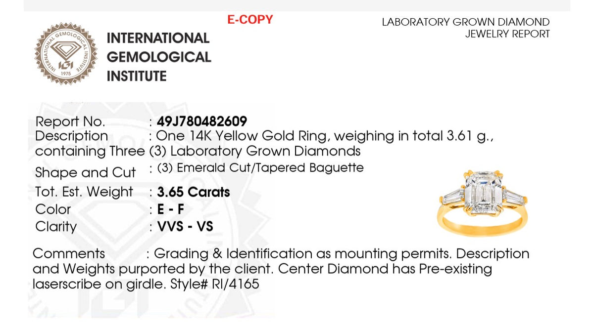 Yellow gold IGI certified emerald cut and tapered baguette lab diamond ring. Center stone is 3.03cts