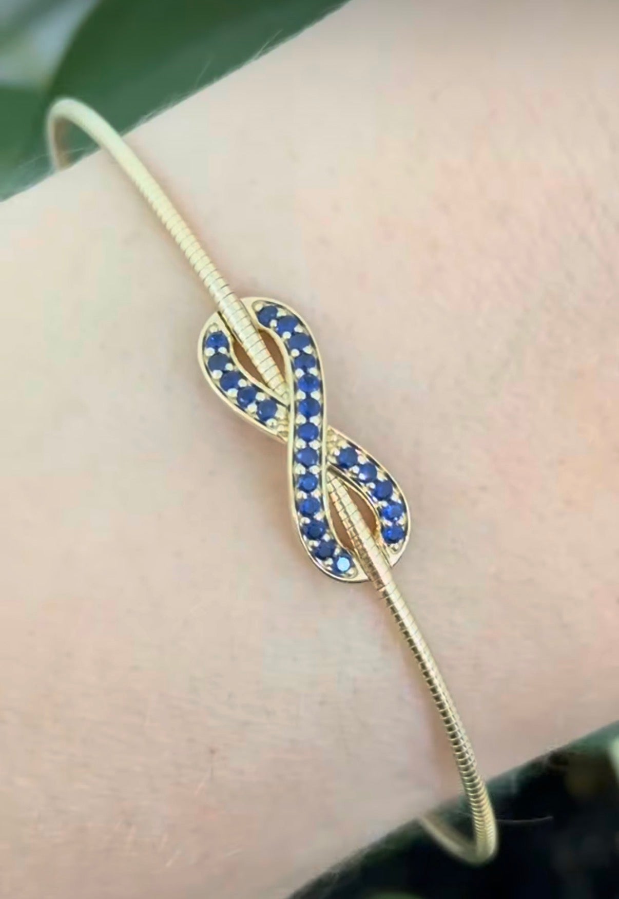 Yellow gold sapphire infinity flex bracelet