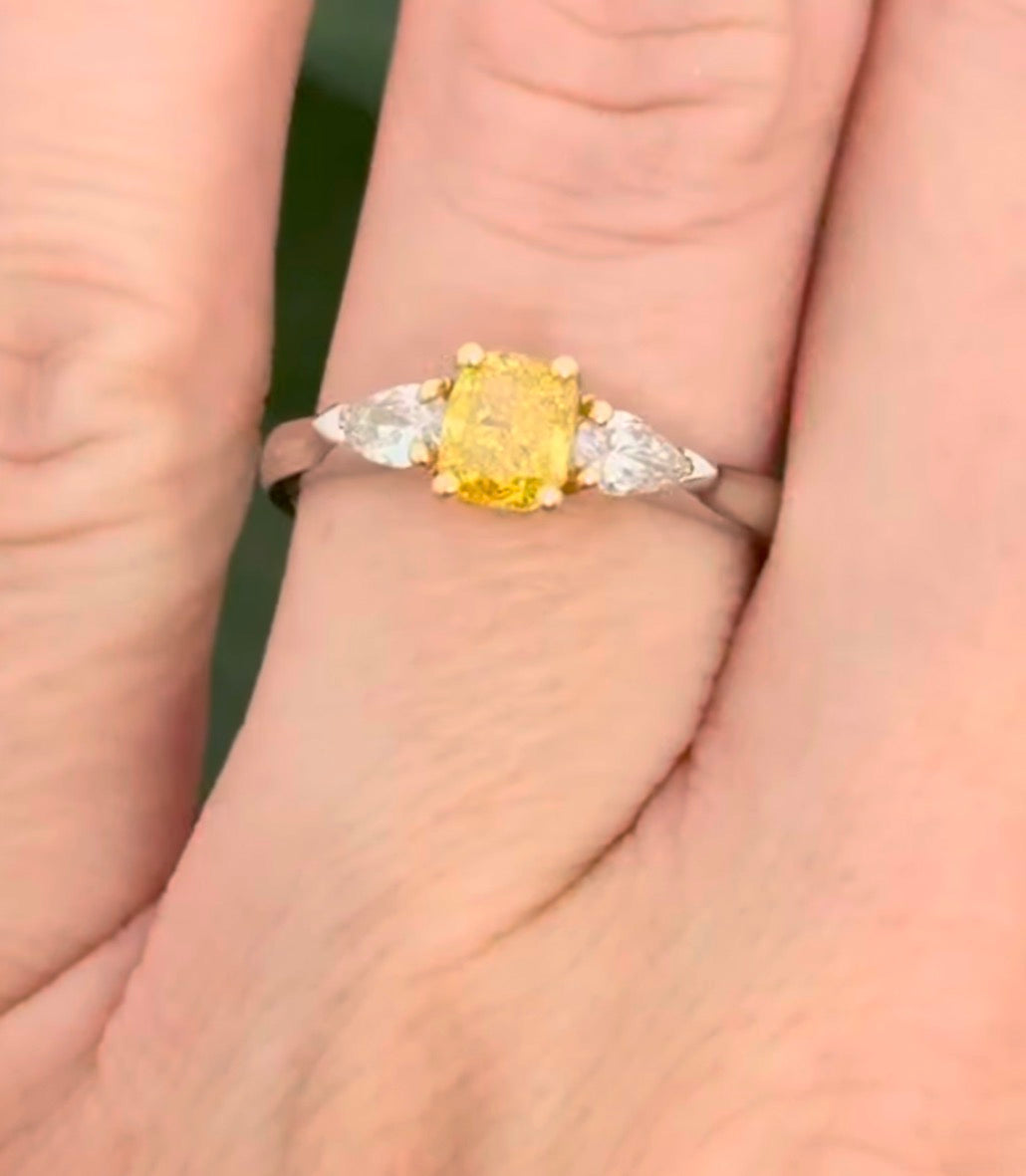 White gold cushion cut yellow lab diamond and pear shape white lab diamond ring. Lab diamonds set in yellow gold.
