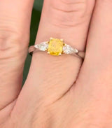 White gold cushion cut yellow lab diamond and pear shape white lab diamond ring. Lab diamonds set in yellow gold.