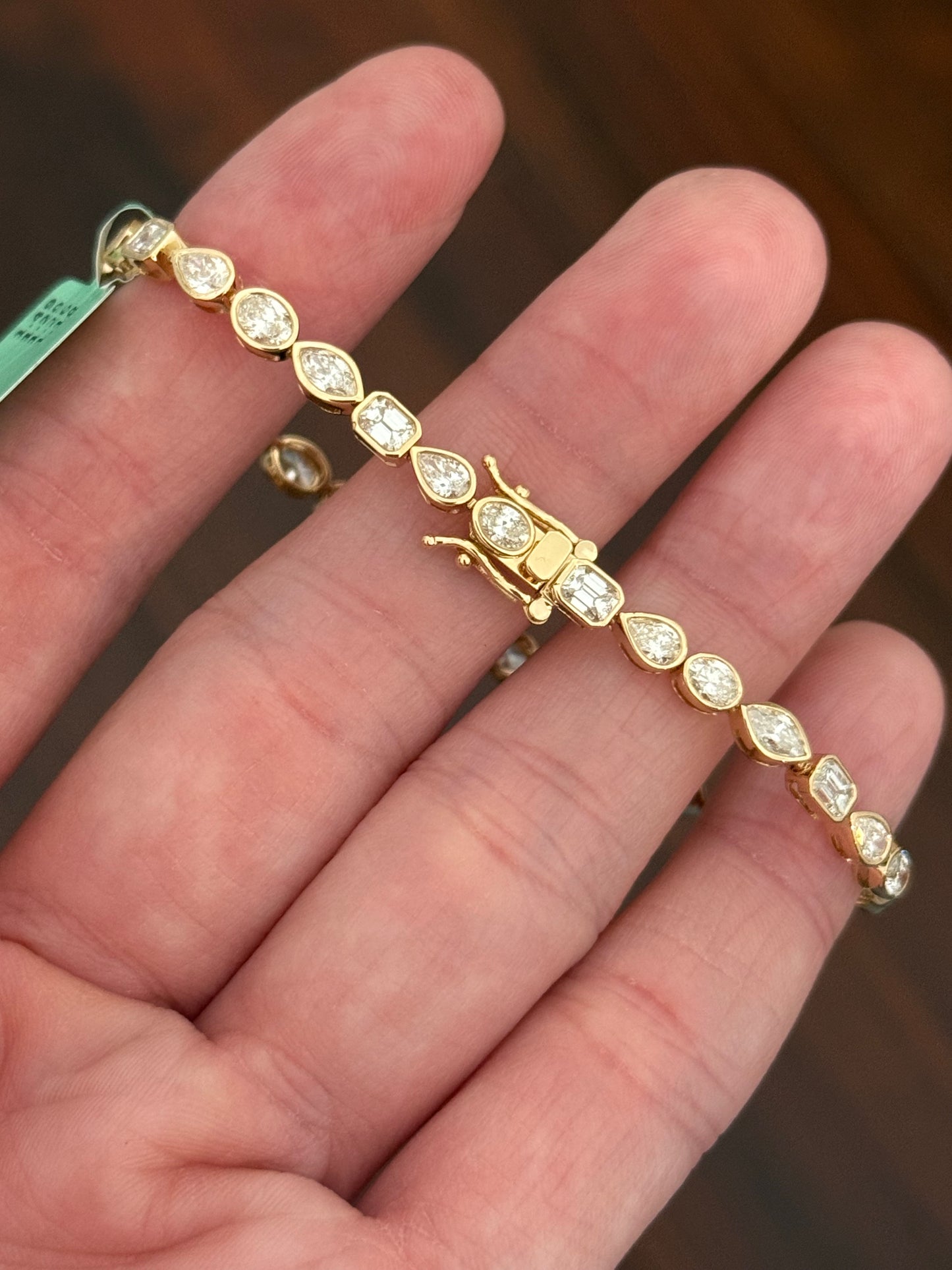 Yellow gold bezel set 5.22ct oval, marquise, pear shape and emerald cut natural diamond bracelet