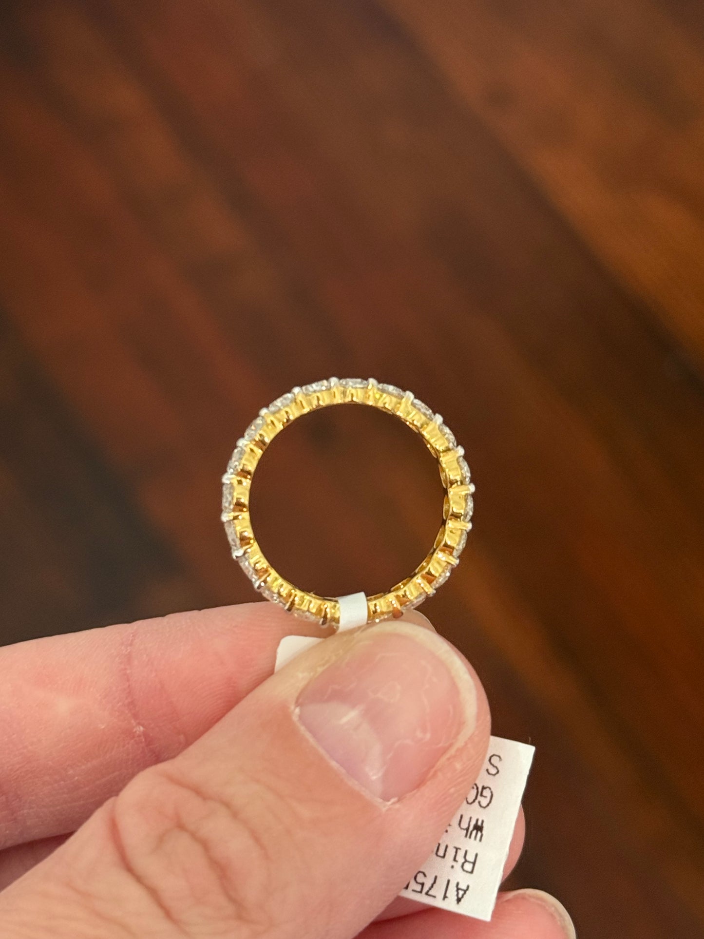 Yellow gold 3.02ct oval lab diamond eternity band. Prongs are white gold.