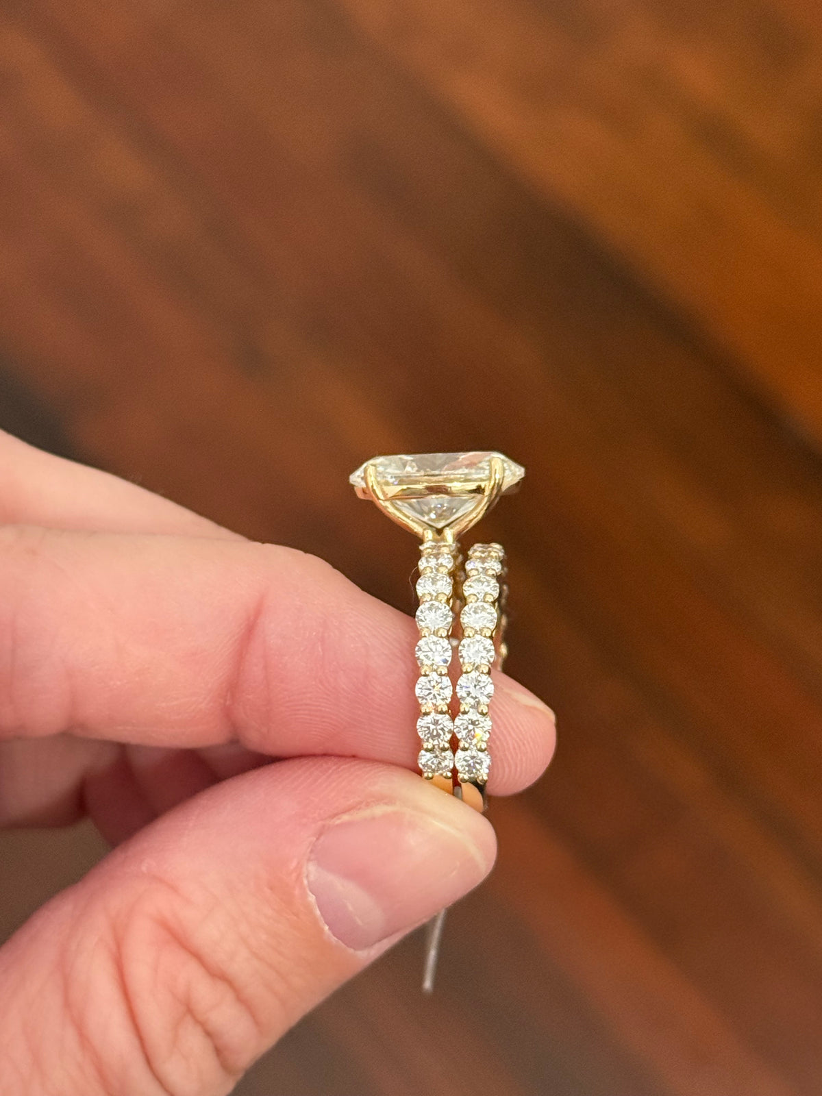 Yellow gold oval and round lab diamond ring and band set. Center stone is 5.1cts