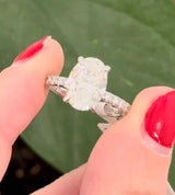 White gold oval lab diamond ring. Center stone is IGI certified and 3.03cts E VVS2