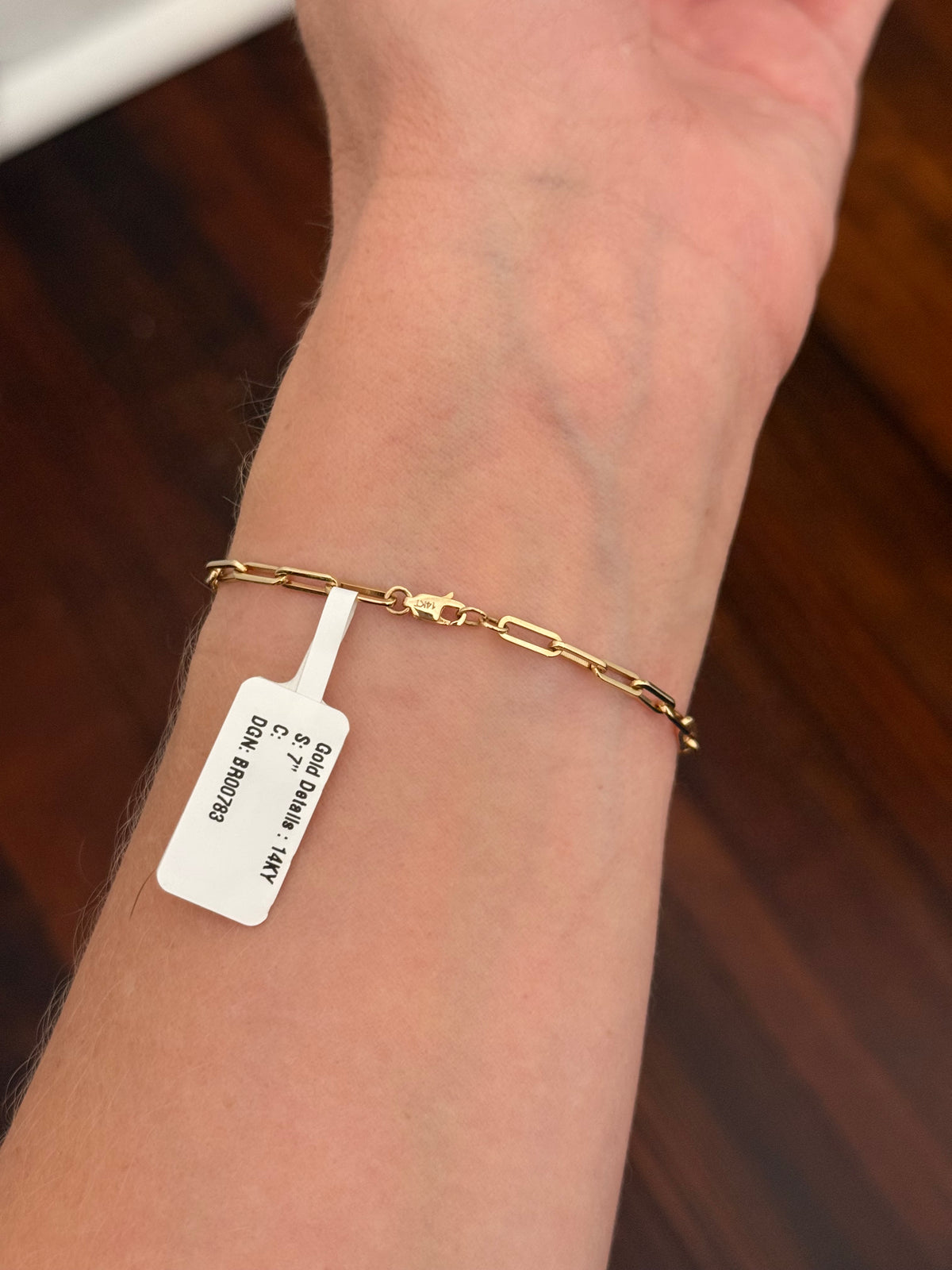 Yellow gold paperclip 3.02ct emerald cut lab diamond bracelet. Emerald cut measures 9.90x6.75mm