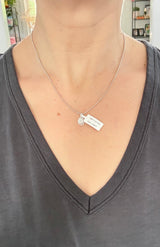 White gold cluster pendant with round diamonds