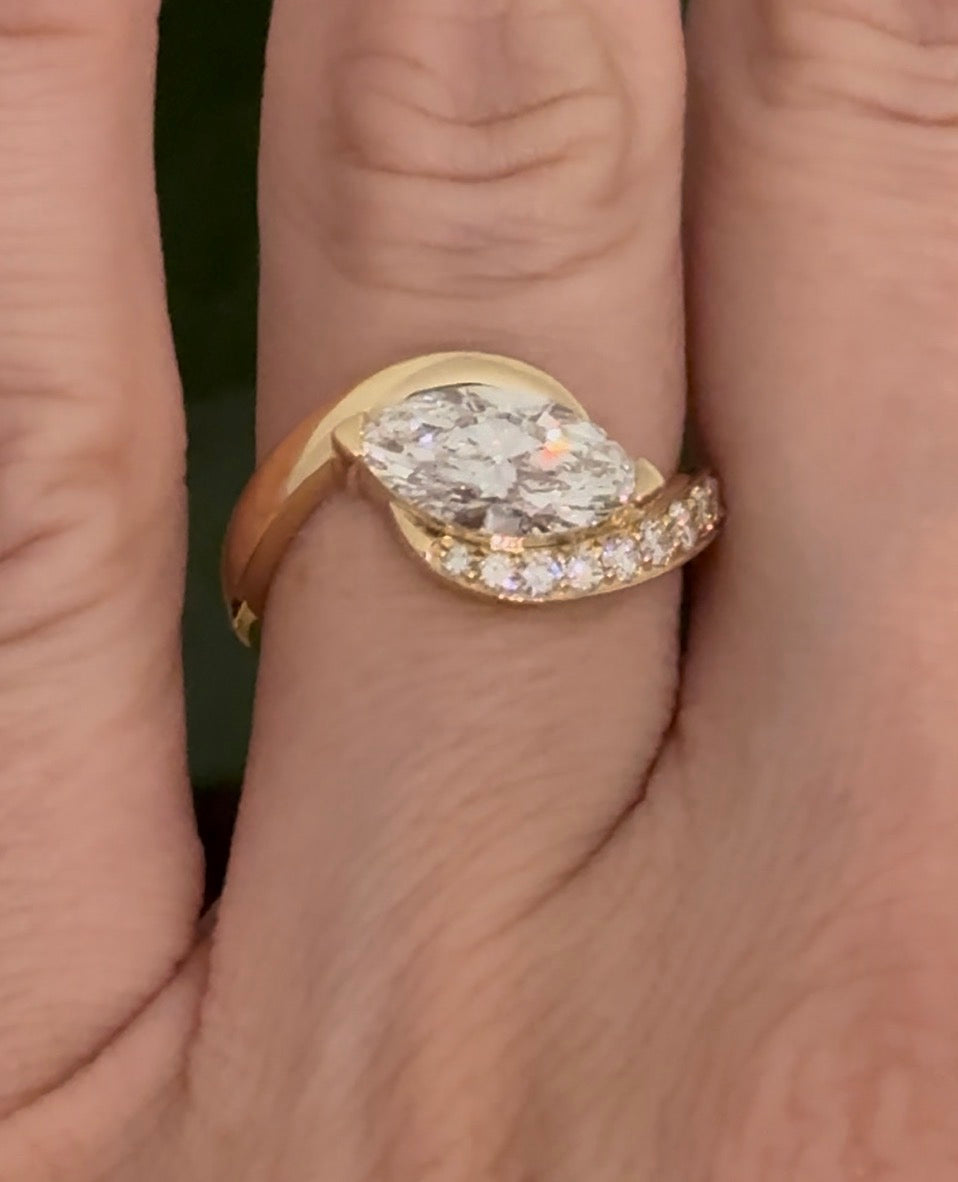 Yellow gold east west set marquise and round lab diamond ring. Marquise is IGI certified and 1.59cts E VS1