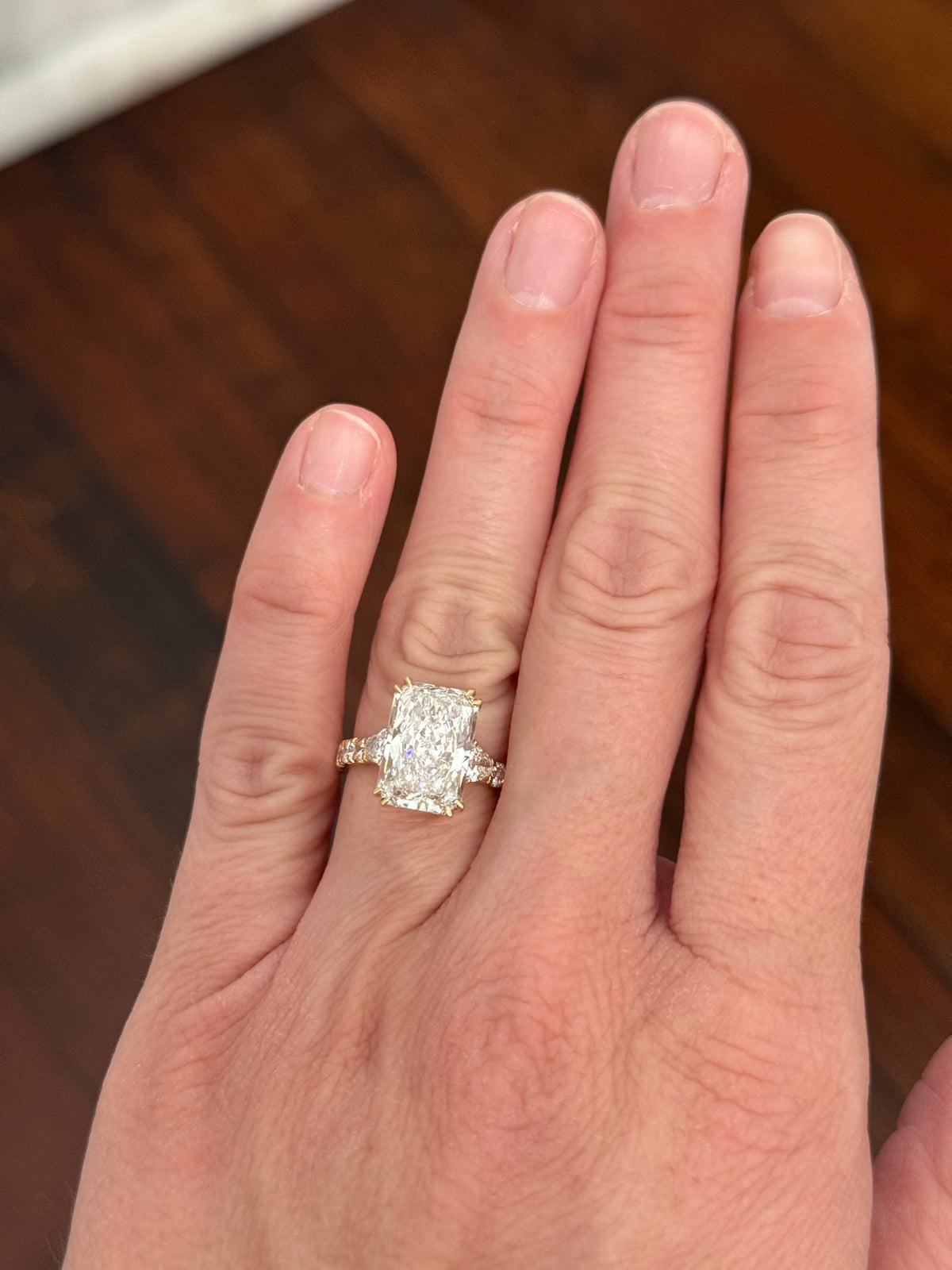 IGI certified radiant and trillion and round lab diamond ring. Center stone is 5.44cts