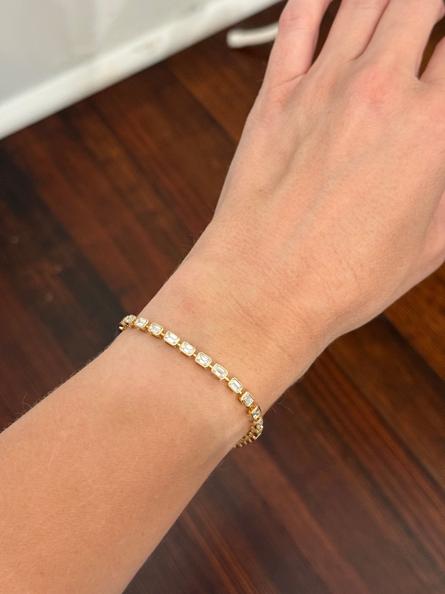 Yellow gold bezel set 5.71ct emerald cut natural diamond bracelet