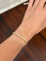 Yellow gold bezel set 5.71ct emerald cut natural diamond bracelet