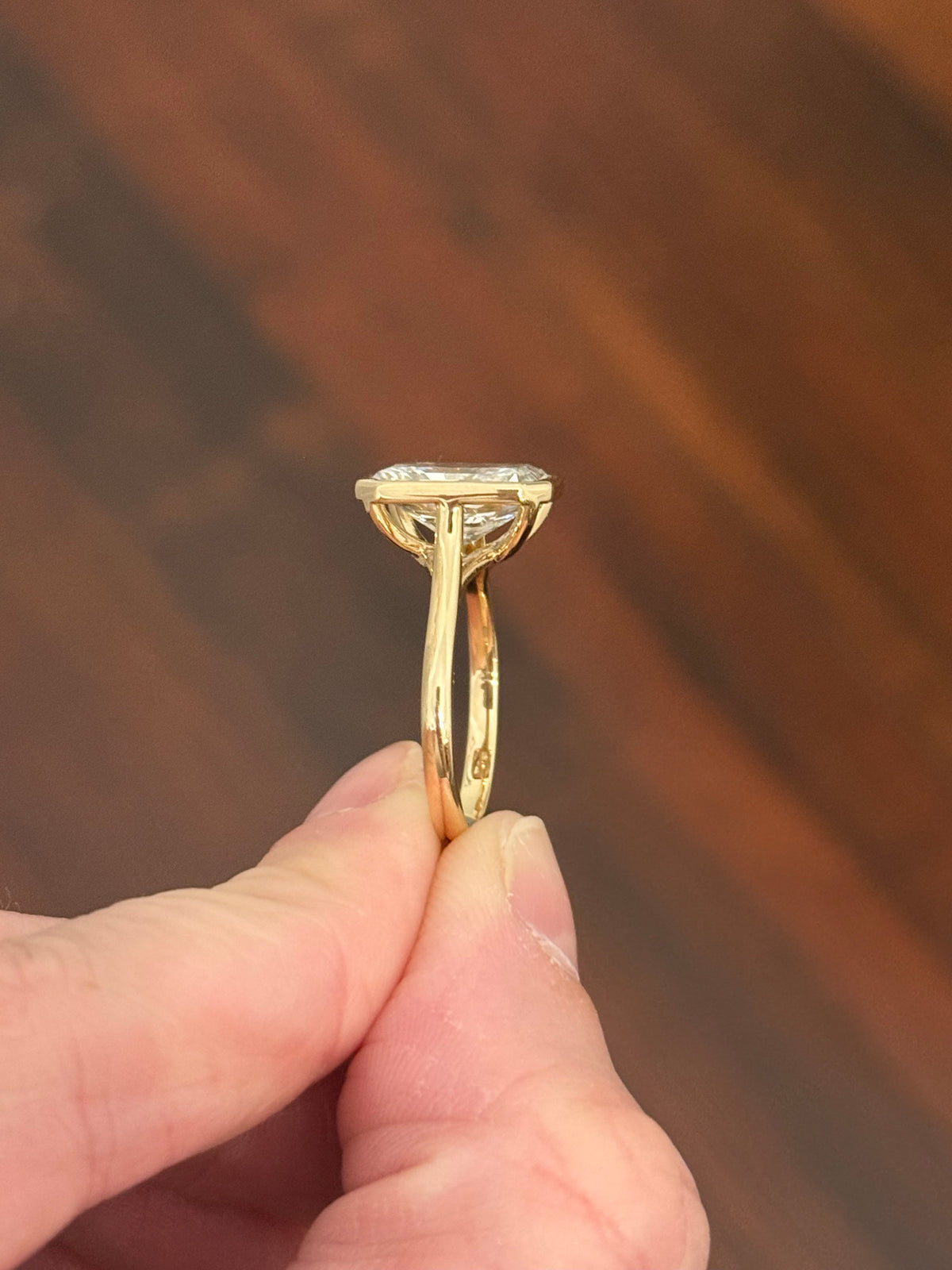 Yellow gold bezel set 3.99ct radiant lab diamond ring