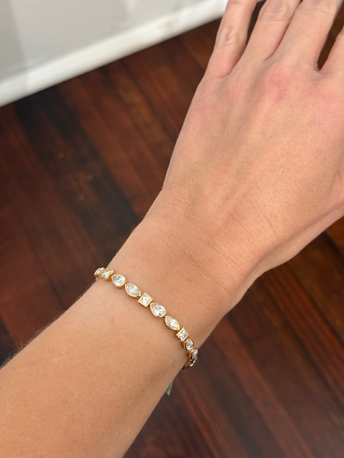 Yellow gold bezel set 8.49ct marquise, pear shape and princess cut natural diamond bracelet