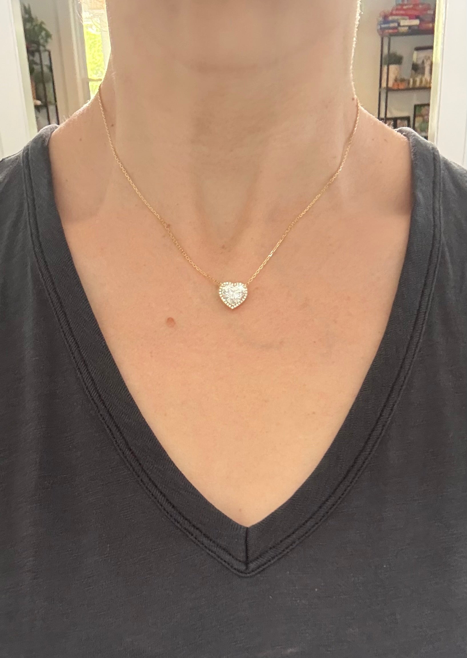 Yellow gold heart shaped lab diamond necklace. Center stone is 3.05cts and measures 8.7x9.6mm. Chain is 16” with 4” of adjustment to make as long as 20”.