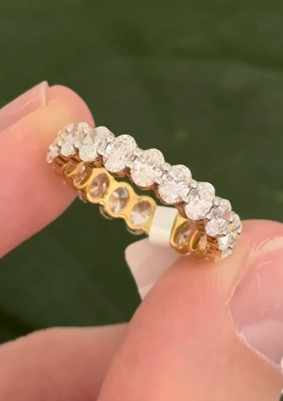 Yellow gold 3.02ct oval lab diamond eternity band. Prongs are white gold.