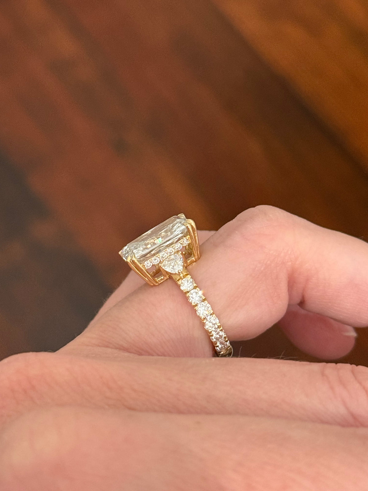 IGI certified radiant and trillion and round lab diamond ring. Center stone is 5.44cts