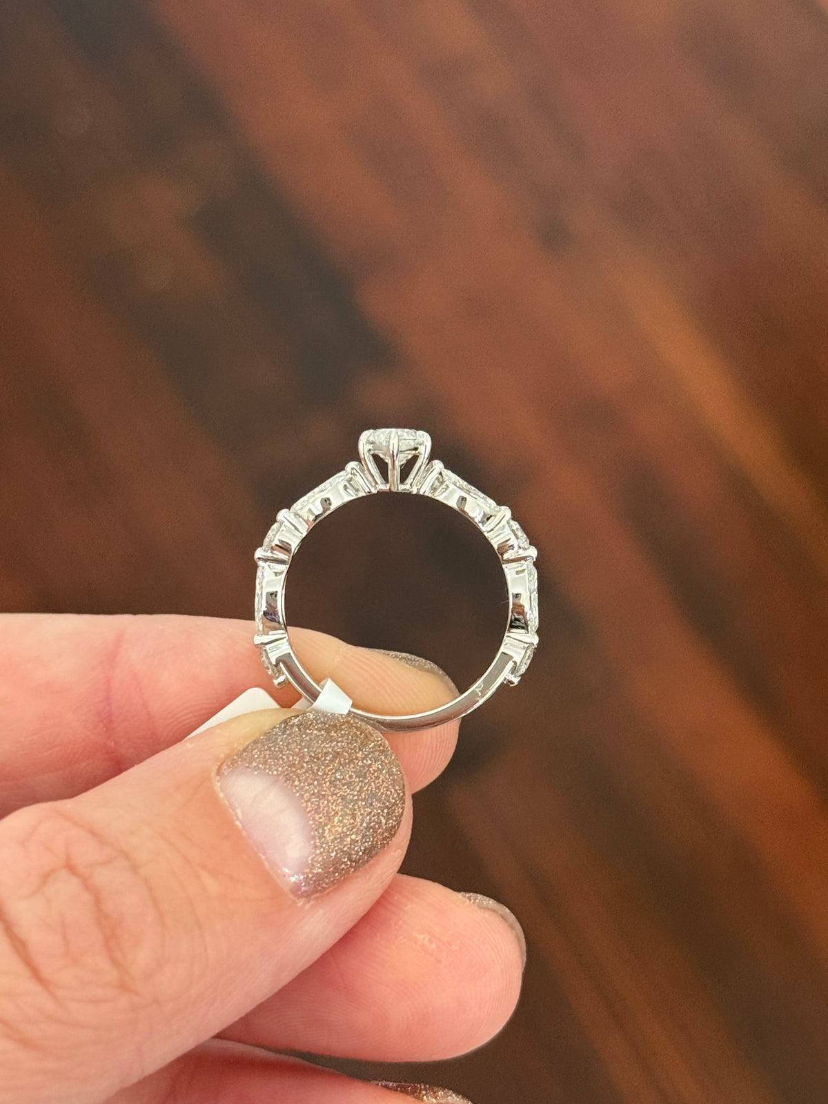 White gold marquise and round lab diamond ring. Center stone is 0.9cts and approximately 10x4.5mn