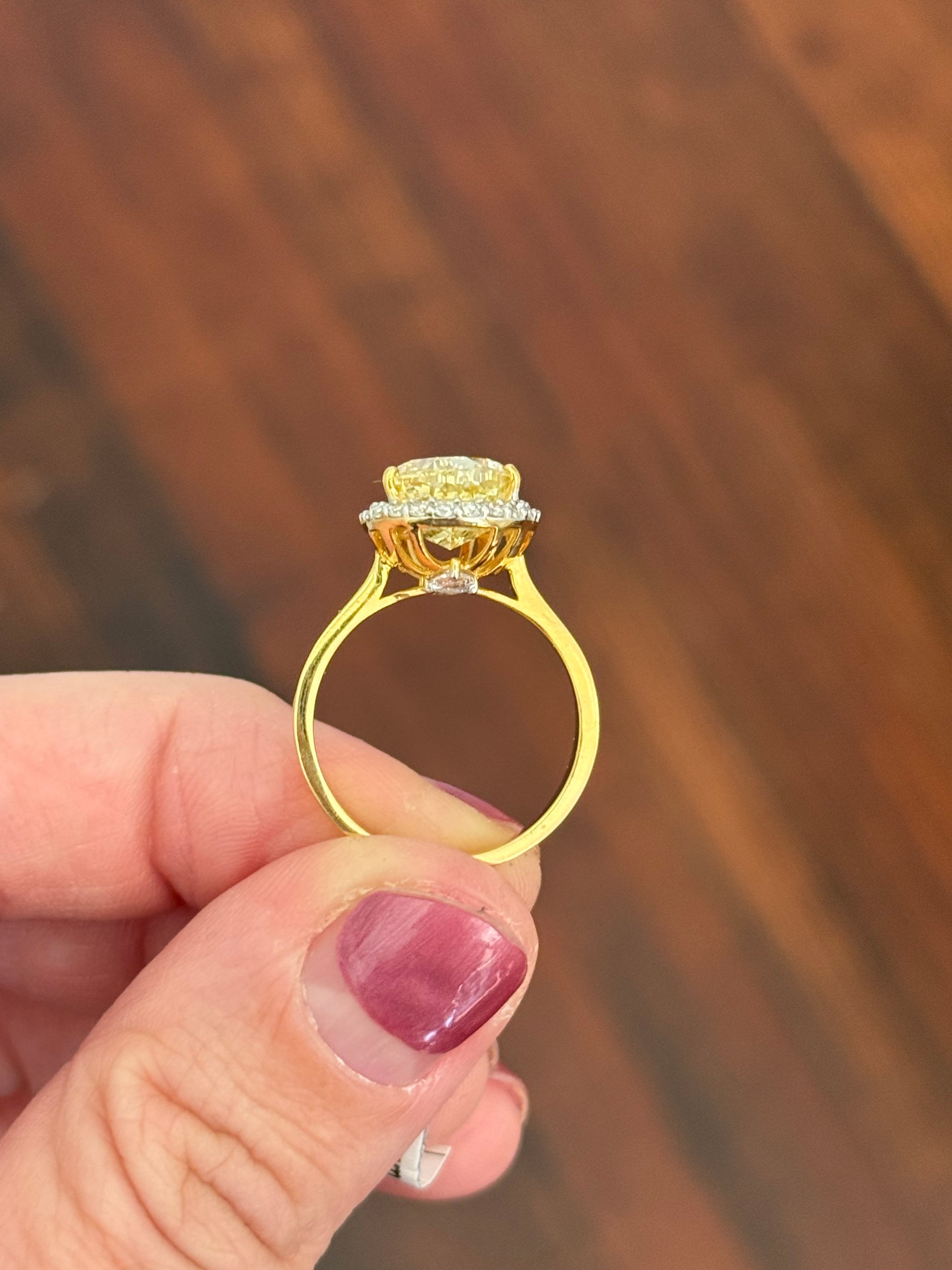 Yellow gold pear shape yellow lab diamond and white lab diamond ring