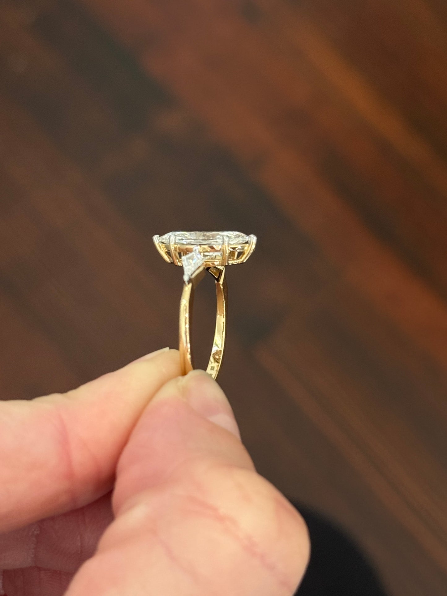 Yellow gold marquise and kite lab diamond ring. Prongs are white gold.
