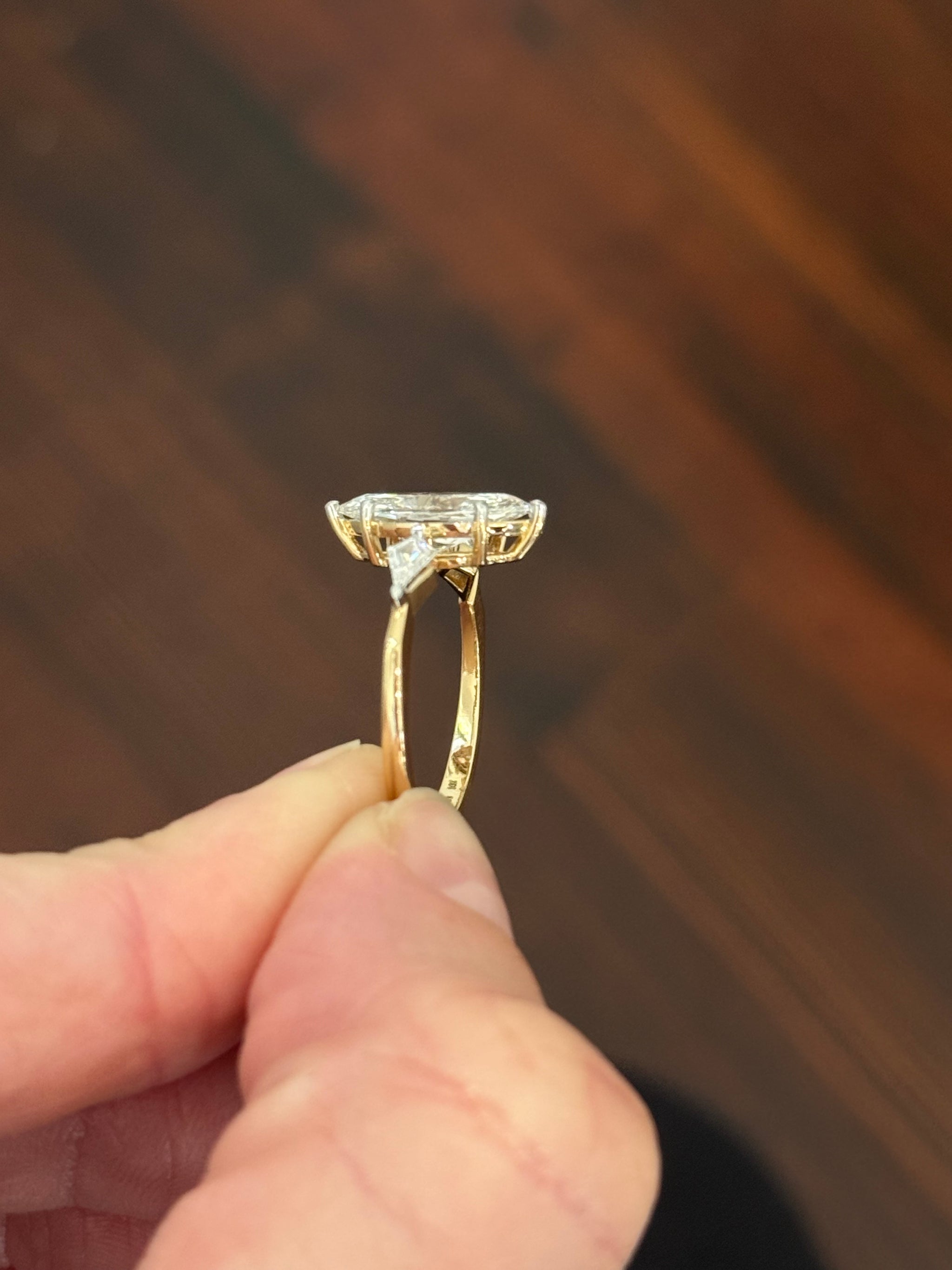 Yellow gold marquise and kite lab diamond ring. Prongs are white gold.