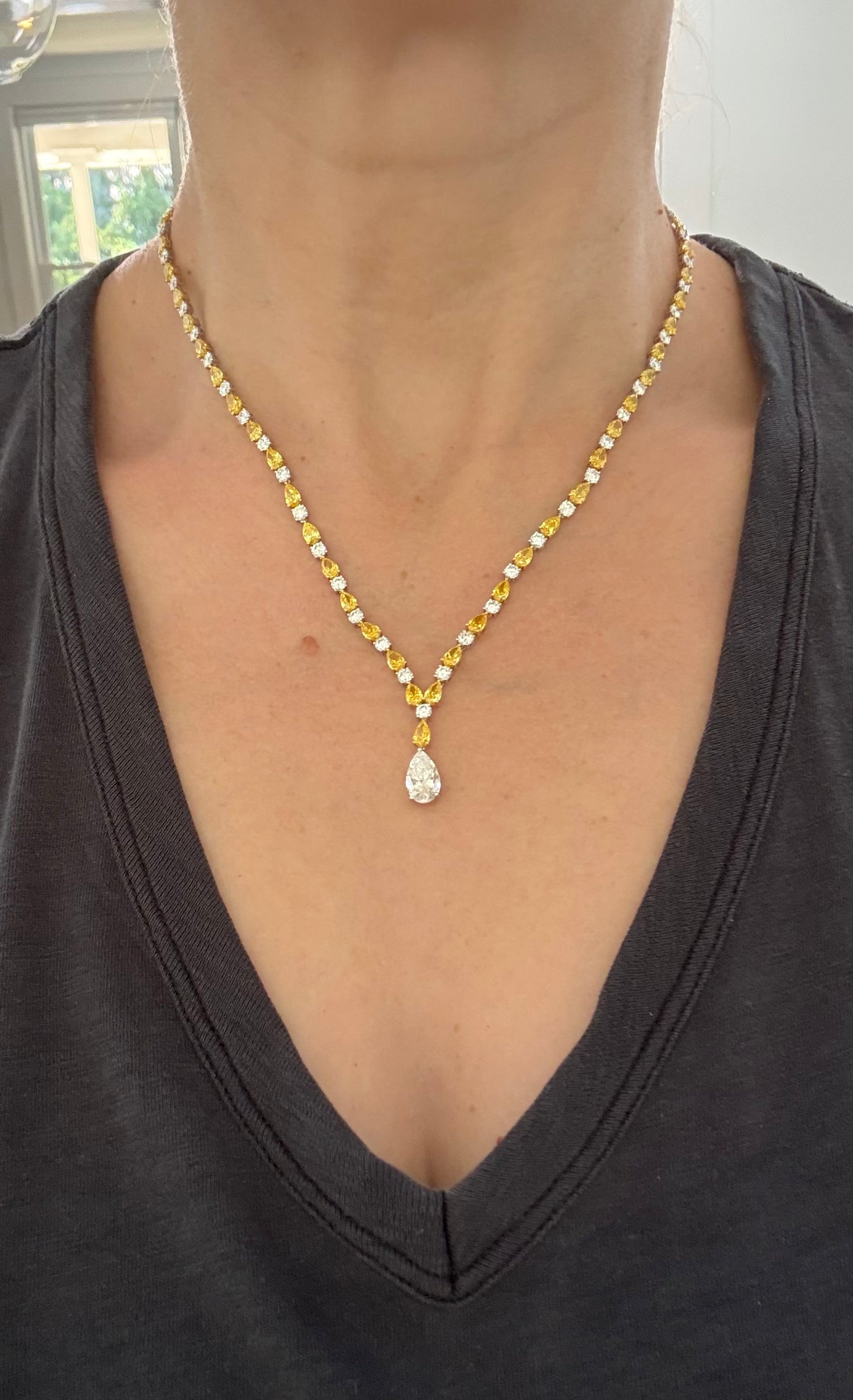 White gold pear shape yellow and white lab diamond and round white lab diamond necklace. Center stone is IGI certified and 1.86cts D VVS2