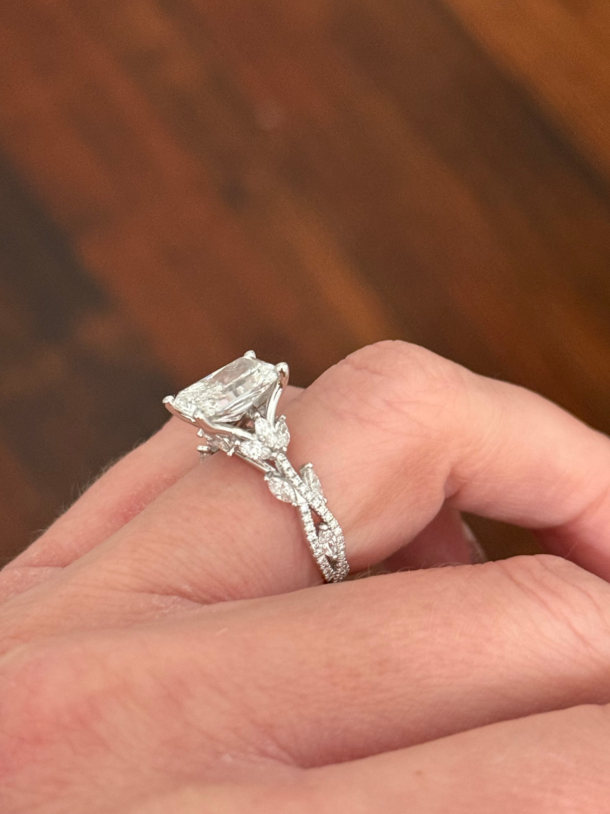 White gold radiant, marquise and round lab diamond ring. Center stone is 3.06cts E VS1 and measures 9.7x6.6mm
