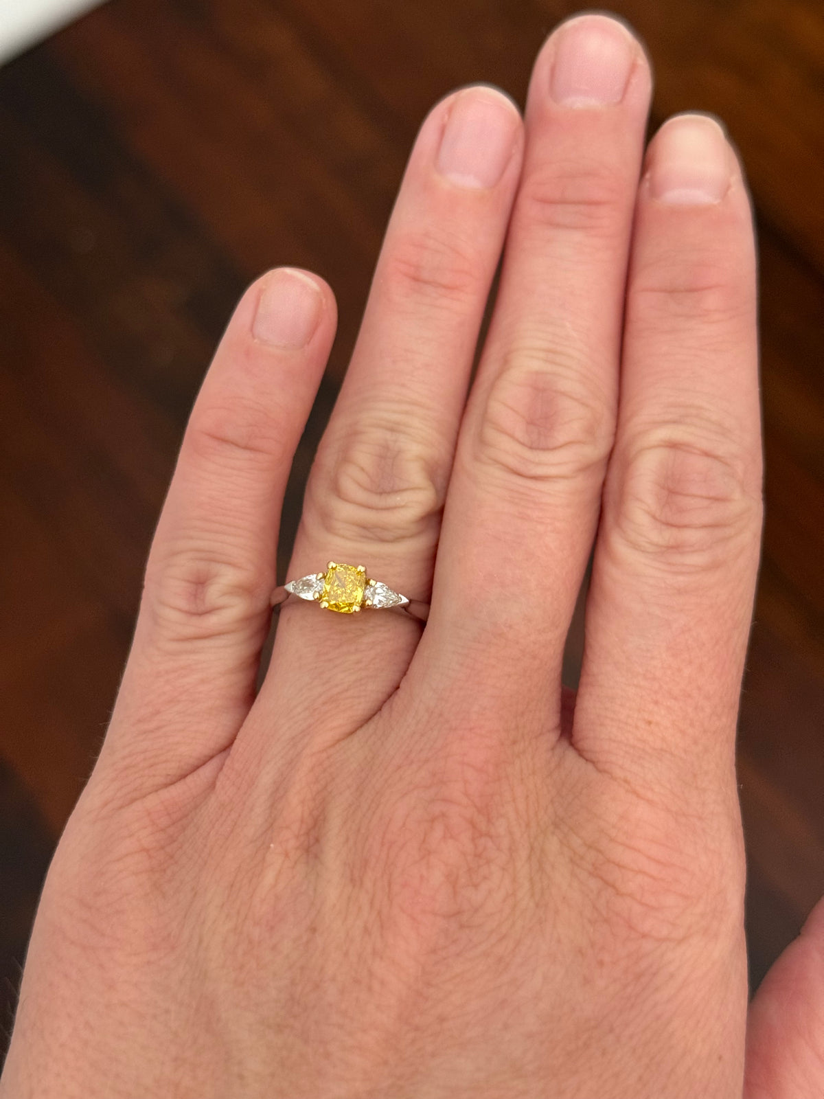 White gold cushion cut yellow lab diamond and pear shape white lab diamond ring. Lab diamonds set in yellow gold.
