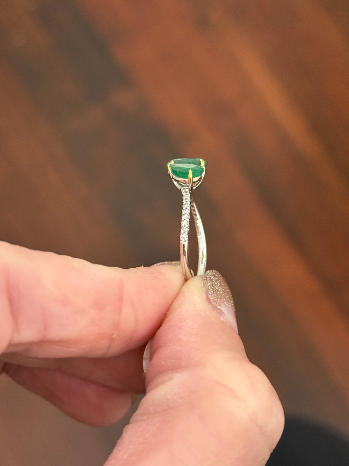White gold natural emerald and diamond ring. Emeralds prongs are yellow gold.