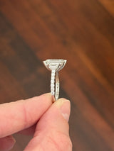 White gold emerald cut, trapezoid, and round lab diamond ring. Center stone is 4.06cts