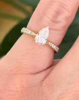 Size 3.75 IGI certified yellow gold pear and round lab diamond ring. Center stone is 0.58cts