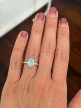 White gold pear shape blue lab diamond and white lab diamond ring