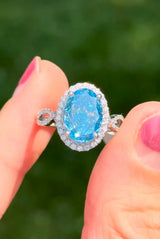 White gold oval blue lab diamond and white lab diamond ring