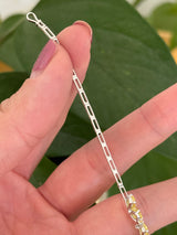 White gold flower bracelet with pear shaped yellow lab diamonds and round white lab diamonds