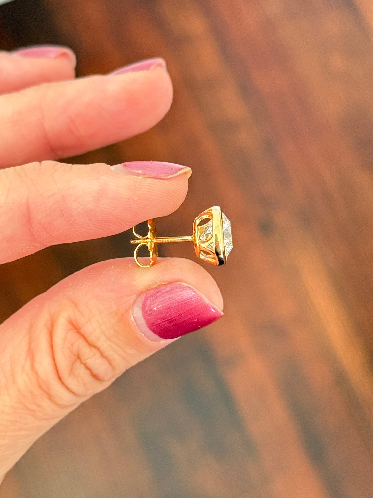 Yellow gold bezel set round lab diamond studs with pushback