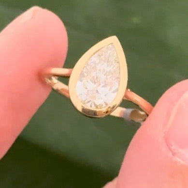 Yellow gold bezel set 1.96ct pear shaped lab diamond ring