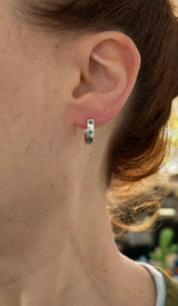 14.3mm hoop earrings available in yellow gold with rubies and white gold with emeralds