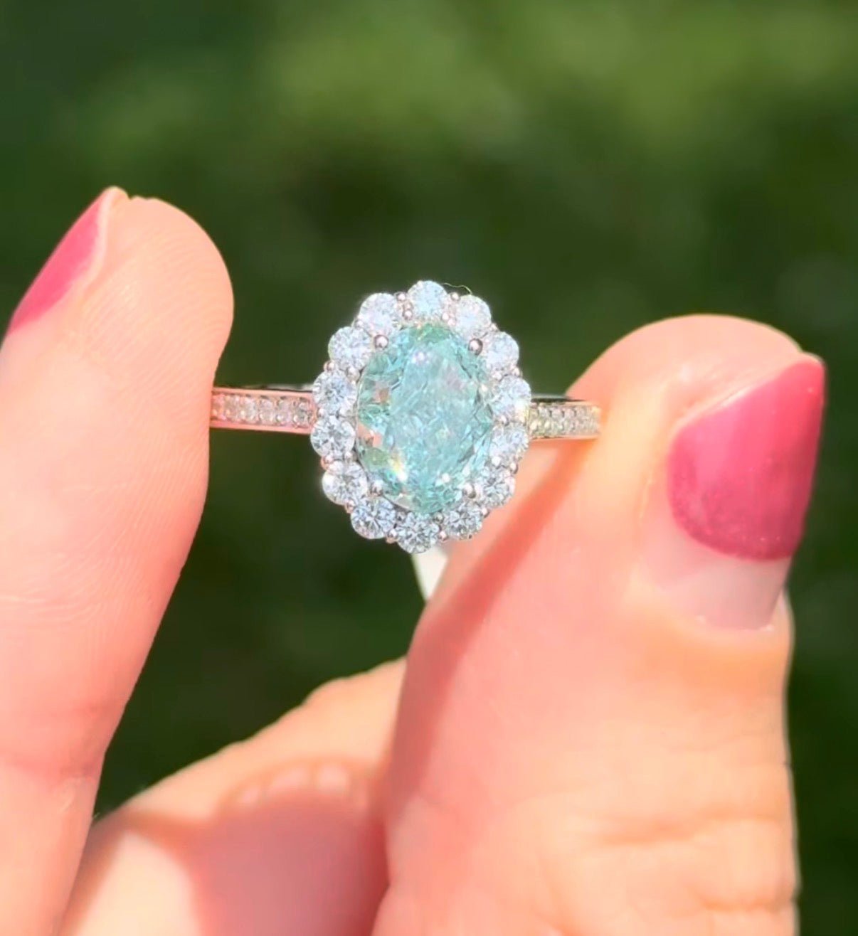 White gold oval blue lab diamond and white lab diamond ring