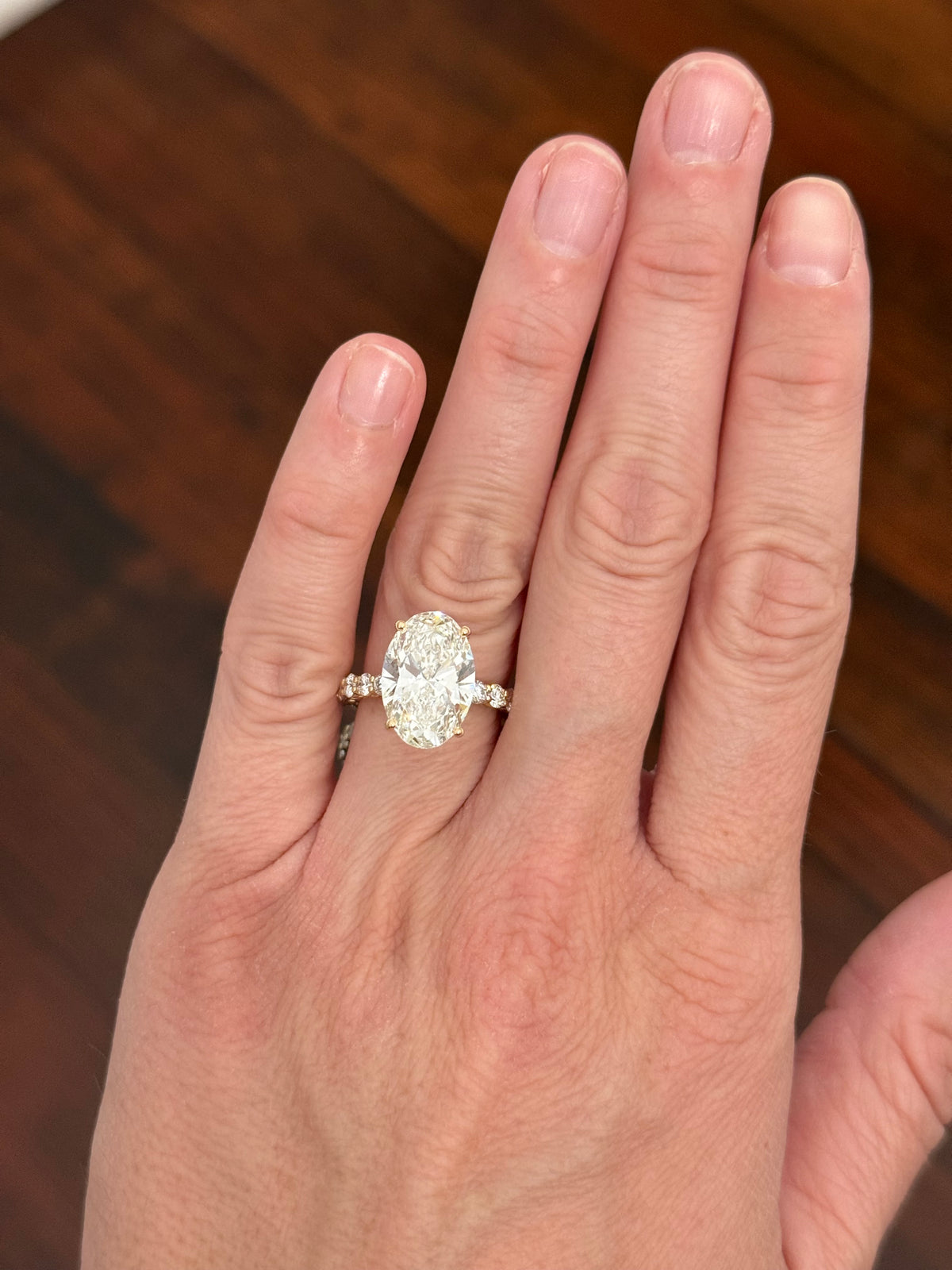Yellow gold oval and round lab diamond ring and band set. Center stone is 6.58cts