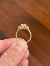 Yellow gold asscher and round lab diamond ring. Prongs are white gold.