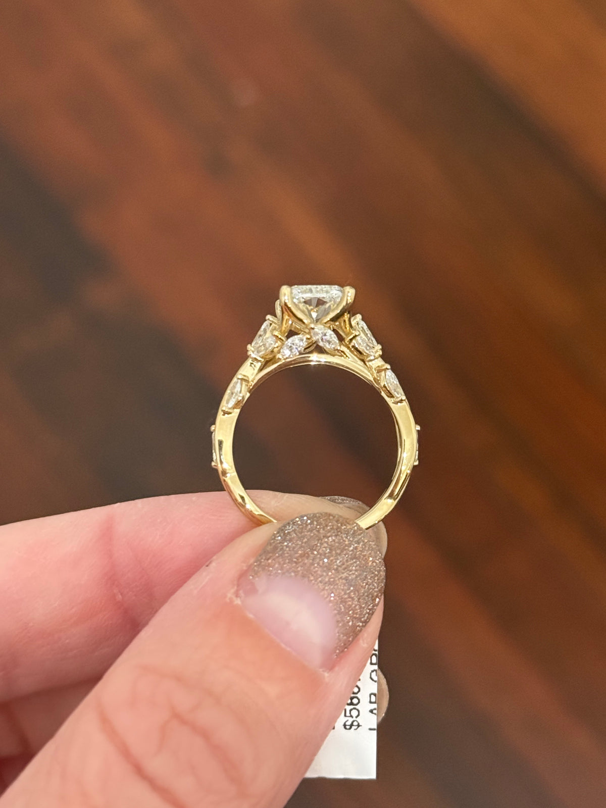 Yellow gold radiant and marquise lab diamond ring. Center stone is 3.07cts E VS1 and measures 9.8x6.7mm
