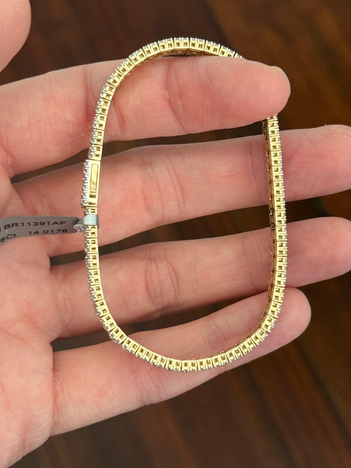 Yellow gold 5.56ct lab diamond bracelet. Prongs are white gold.