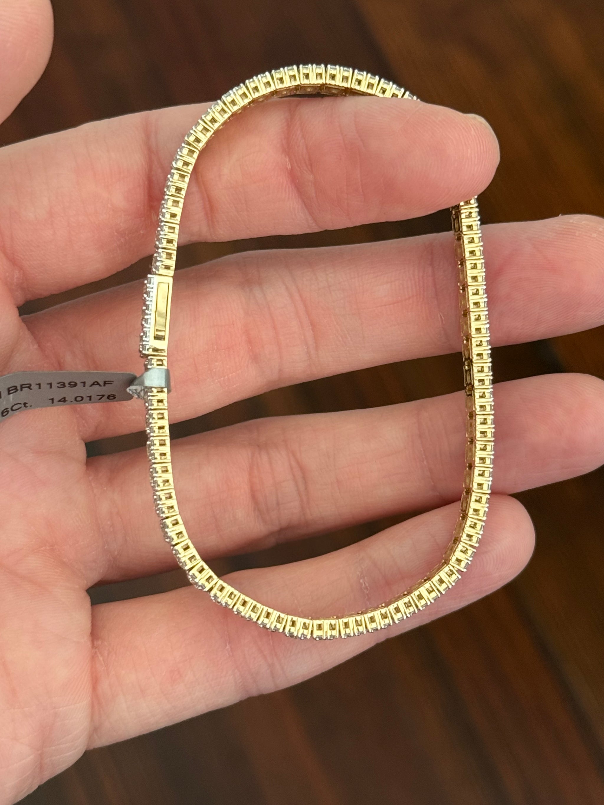 Yellow gold 5.56ct lab diamond bracelet. Prongs are white gold.