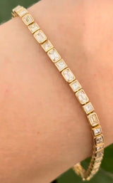 Yellow gold bezel and east west set 4.5ct emerald and princess cut natural diamond bracelet