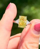 White gold radiant yellow lab diamond and trillion cut white lab diamond ring