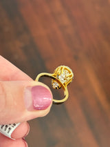 Yellow gold pear shape yellow lab diamond and white lab diamond ring
