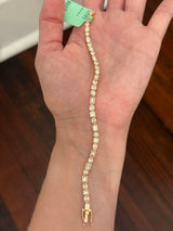 Yellow gold bezel set 6.68ct pear shape, oval, princess and emerald cut natural diamond bracelet