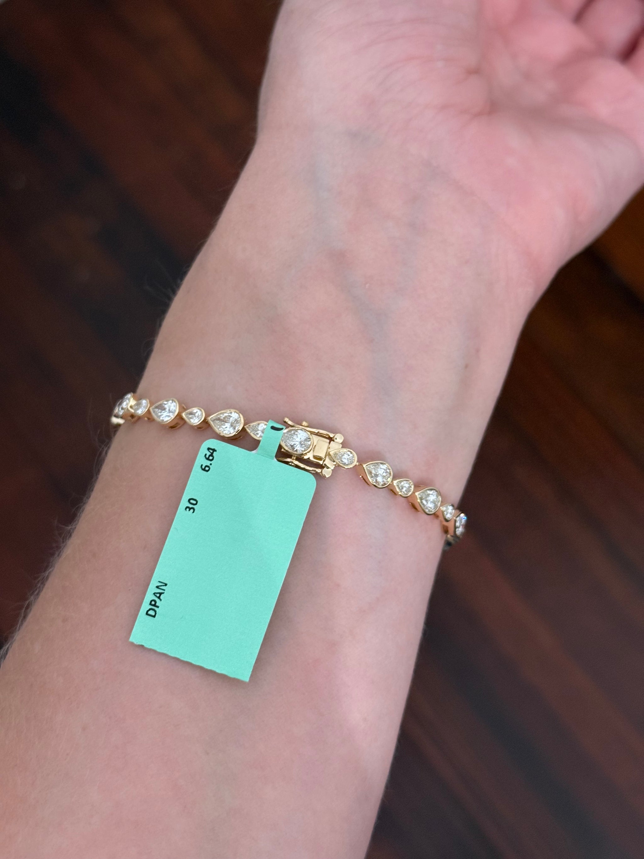 Yellow gold bezel set 6.64ct pear shaped natural diamond bracelet