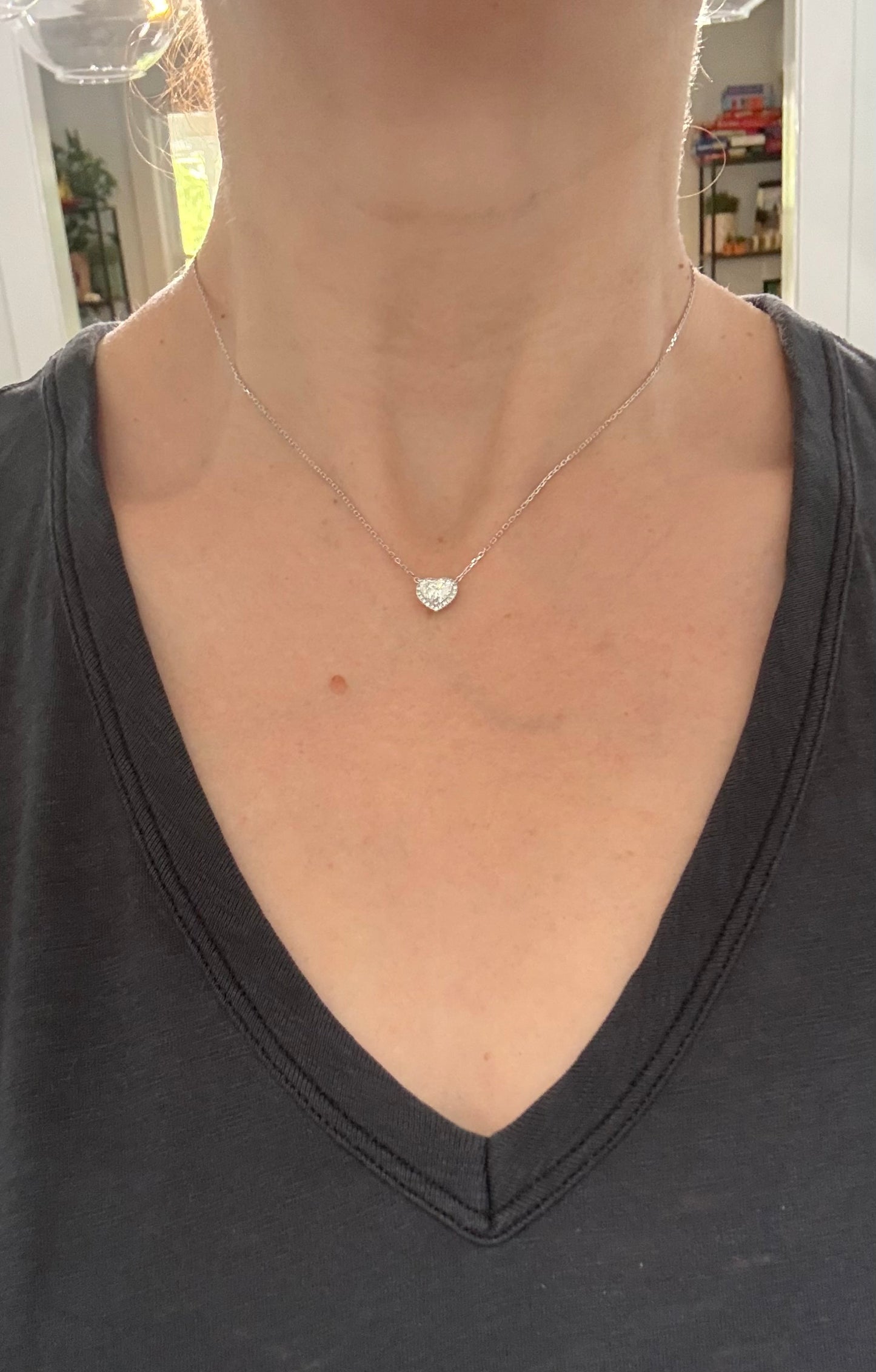 White gold heart shaped lab diamond necklace. Center stone is 1.05cts and measures 6x6.9mm. Chain is 16” with an adjustment of 4” to make as long as 20”.