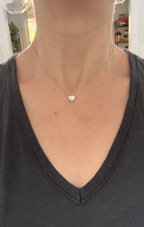 White gold heart shaped lab diamond necklace. Center stone is 1.05cts and measures 6x6.9mm. Chain is 16” with an adjustment of 4” to make as long as 20”.
