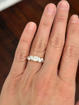 Yellow gold cushion, pear shape and round lab diamond ring. Prongs are white gold.