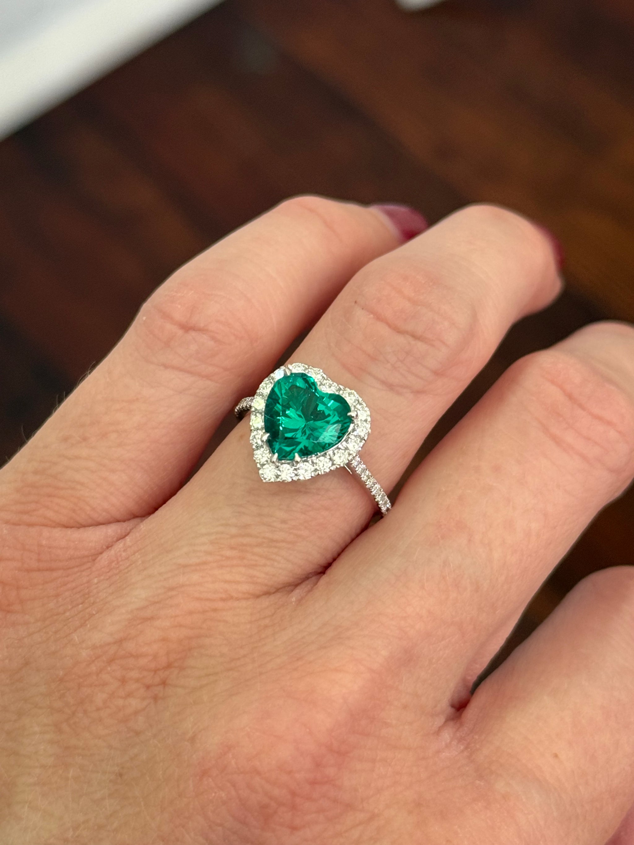 White gold heart shape lab emerald and round lab diamond ring